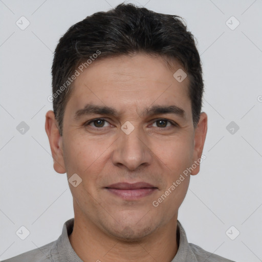 Joyful white adult male with short  brown hair and brown eyes