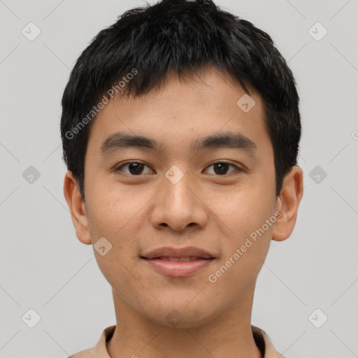 Joyful asian young-adult male with short  brown hair and brown eyes