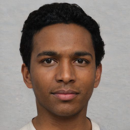 Neutral black young-adult male with short  black hair and brown eyes