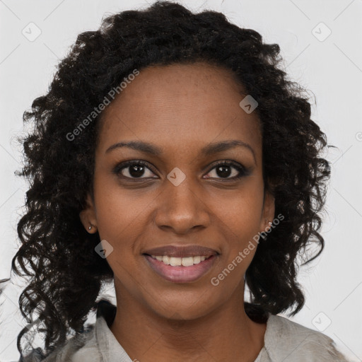 Joyful black young-adult female with long  brown hair and brown eyes