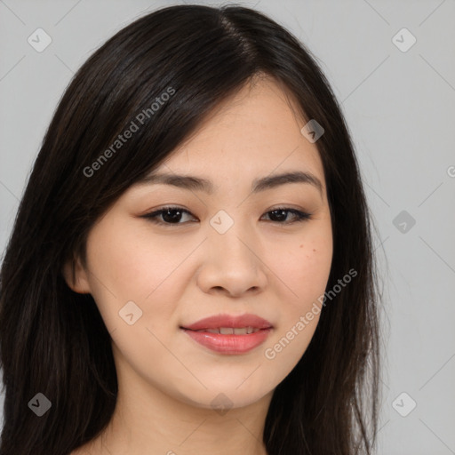 Joyful asian young-adult female with long  brown hair and brown eyes