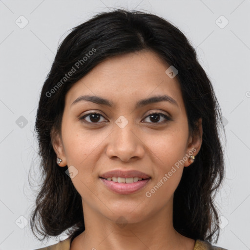 Joyful latino young-adult female with medium  brown hair and brown eyes