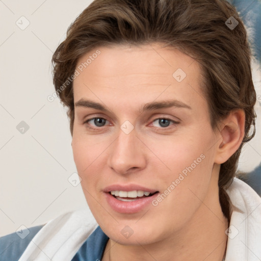 Joyful white young-adult female with short  brown hair and brown eyes