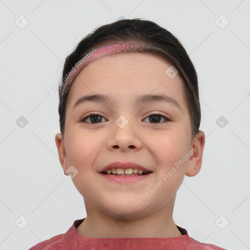 Joyful white child female with short  brown hair and brown eyes