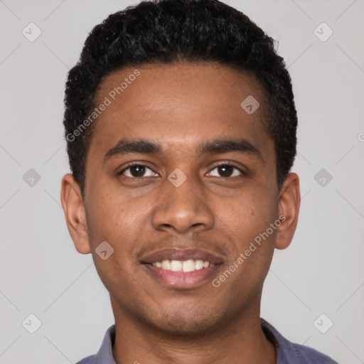 Joyful black young-adult male with short  black hair and brown eyes