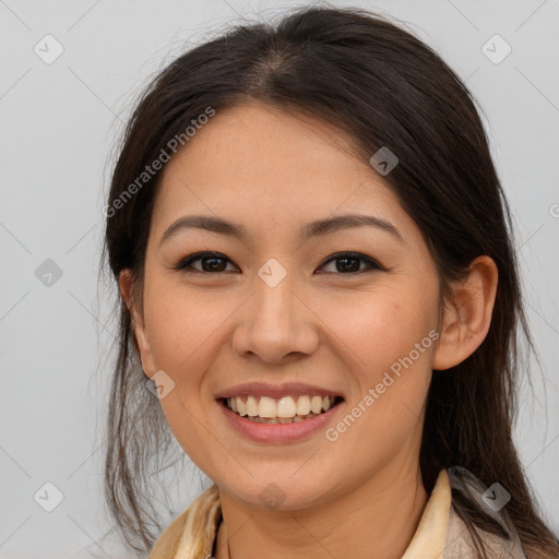 Joyful asian young-adult female with long  brown hair and brown eyes