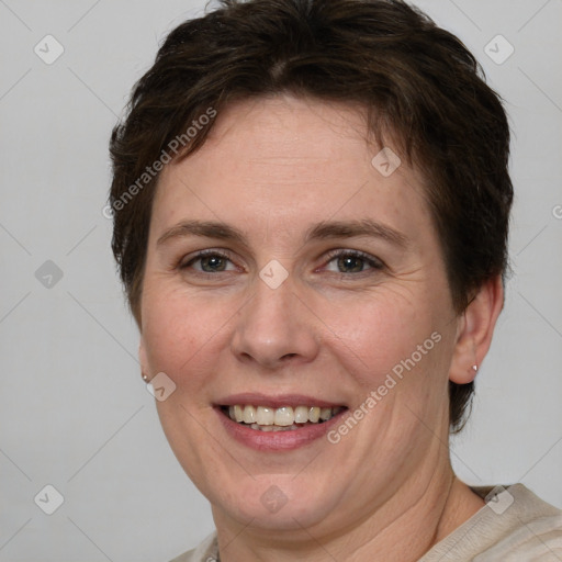 Joyful white adult female with medium  brown hair and grey eyes