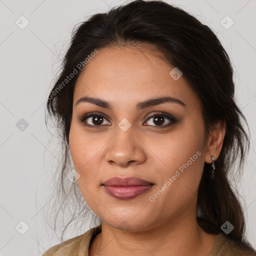 Joyful latino young-adult female with medium  brown hair and brown eyes