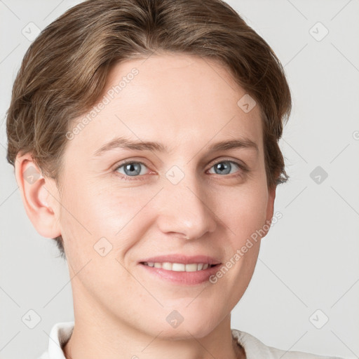 Joyful white young-adult female with short  brown hair and grey eyes