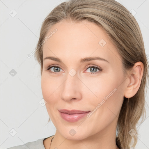 Joyful white young-adult female with medium  brown hair and blue eyes