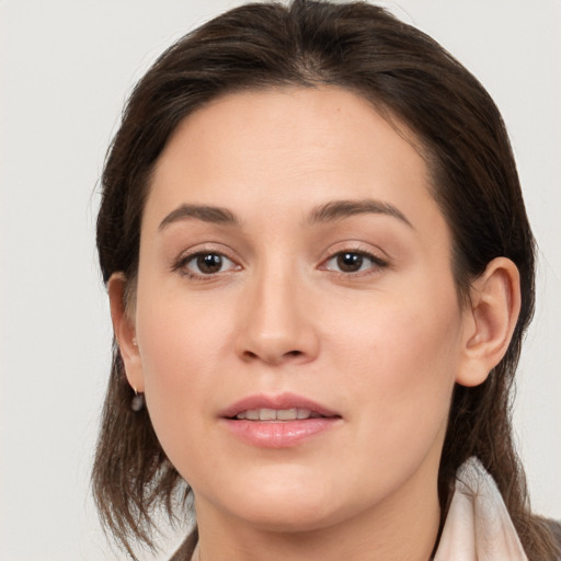 Joyful white young-adult female with medium  brown hair and brown eyes