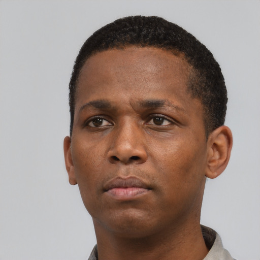 Neutral black young-adult male with short  black hair and brown eyes