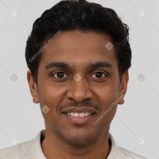 Joyful black young-adult male with short  brown hair and brown eyes