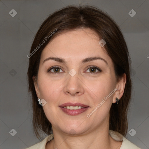 Joyful white adult female with medium  brown hair and brown eyes