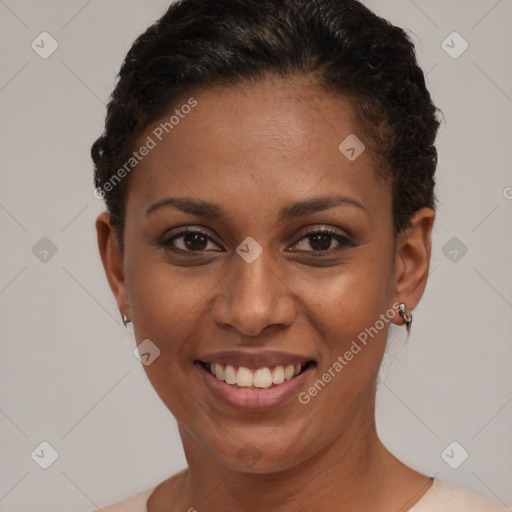 Joyful black young-adult female with short  brown hair and brown eyes