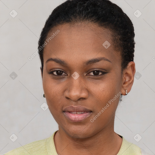 Joyful black young-adult female with short  black hair and brown eyes