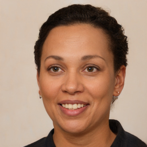 Joyful white adult female with short  brown hair and brown eyes