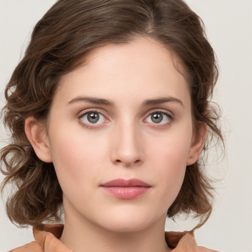 Neutral white young-adult female with medium  brown hair and green eyes