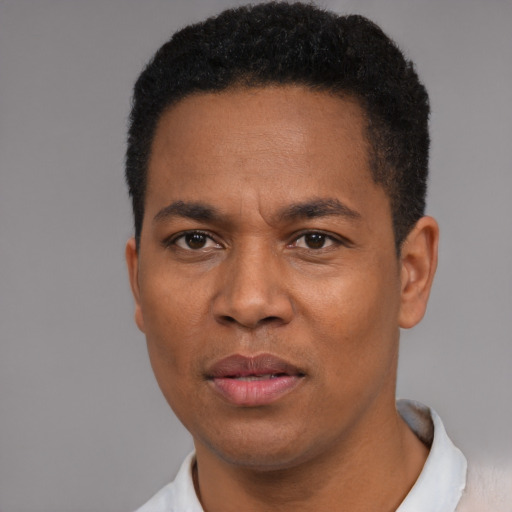 Neutral black young-adult male with short  black hair and brown eyes