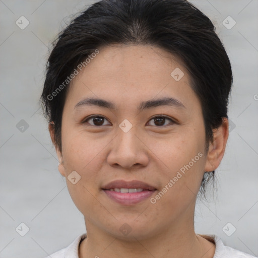 Joyful asian young-adult female with medium  brown hair and brown eyes