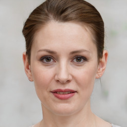 Joyful white adult female with short  brown hair and grey eyes