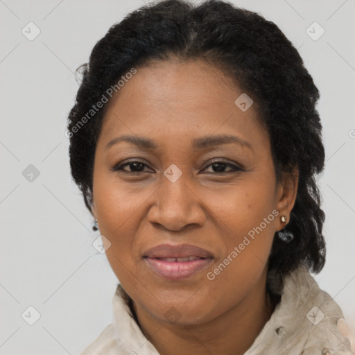 Joyful black adult female with short  brown hair and brown eyes