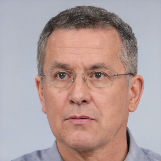 Neutral white middle-aged male with short  gray hair and brown eyes