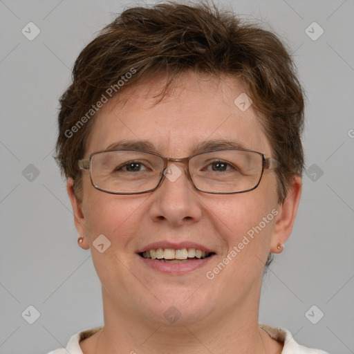 Joyful white adult female with short  brown hair and brown eyes