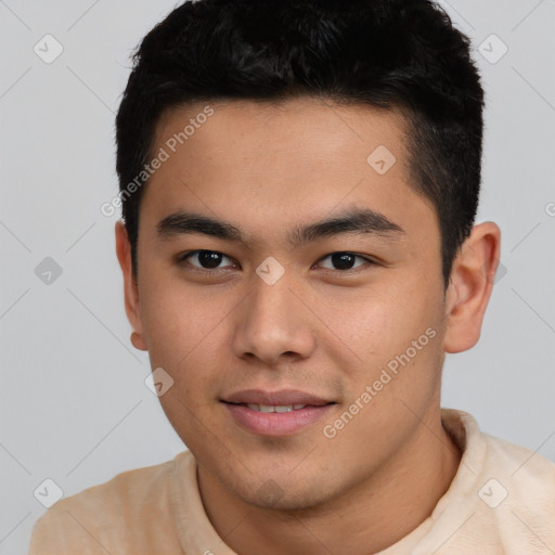 Joyful asian young-adult male with short  brown hair and brown eyes