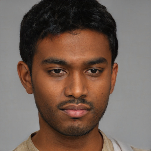 Neutral latino young-adult male with short  brown hair and brown eyes