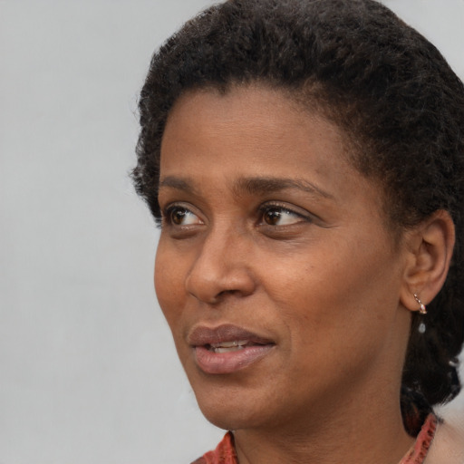 Neutral black adult female with short  black hair and brown eyes