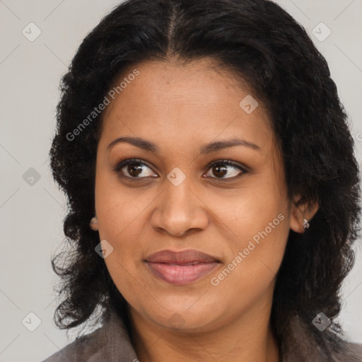 Joyful black young-adult female with long  brown hair and brown eyes