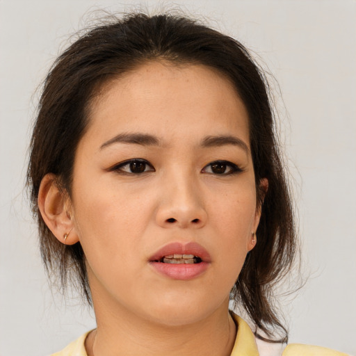 Neutral asian young-adult female with medium  brown hair and brown eyes