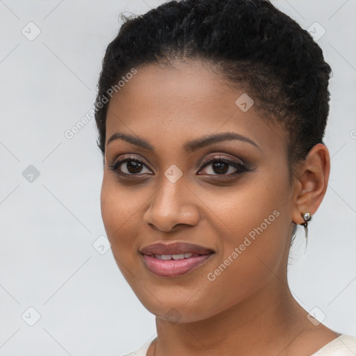 Joyful black young-adult female with short  brown hair and brown eyes