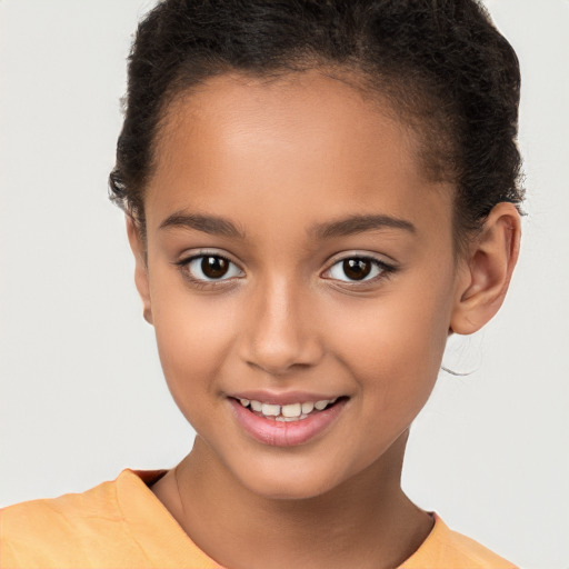 Joyful white child female with short  brown hair and brown eyes