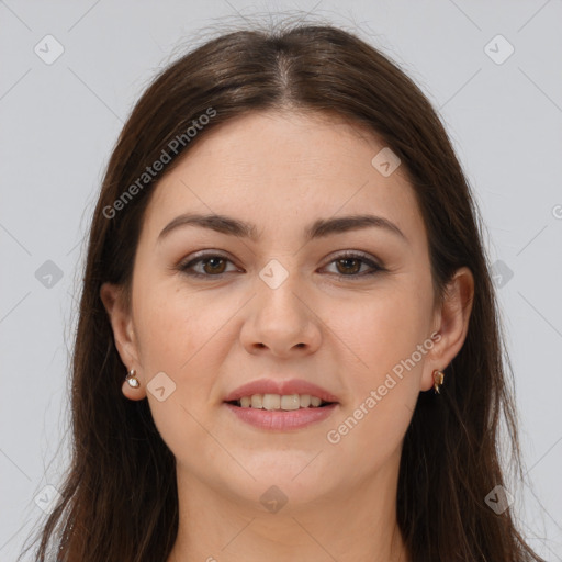 Joyful white young-adult female with long  brown hair and brown eyes