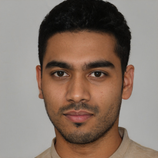 Neutral latino young-adult male with short  black hair and brown eyes