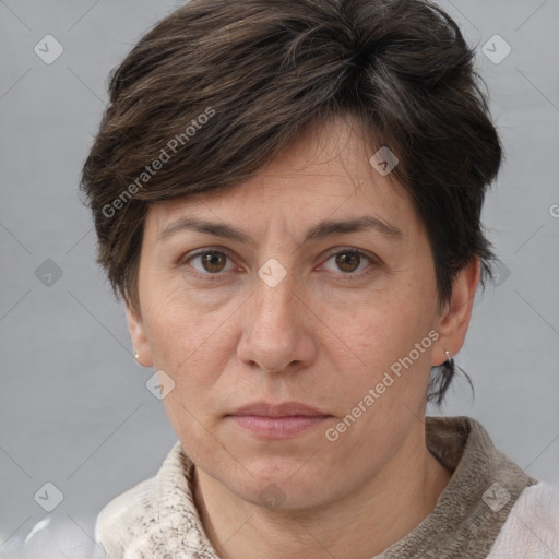 Joyful white adult female with short  brown hair and grey eyes