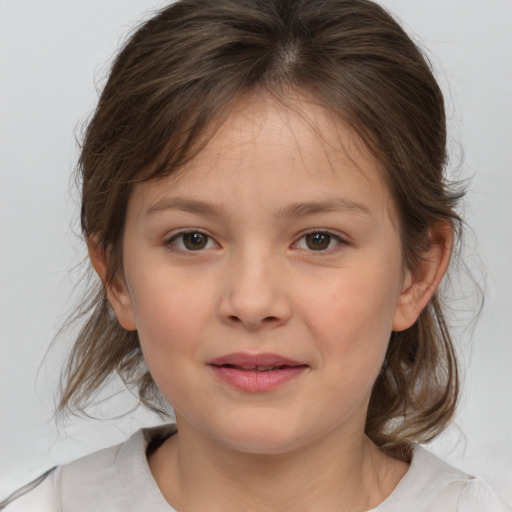 Joyful white child female with medium  brown hair and brown eyes