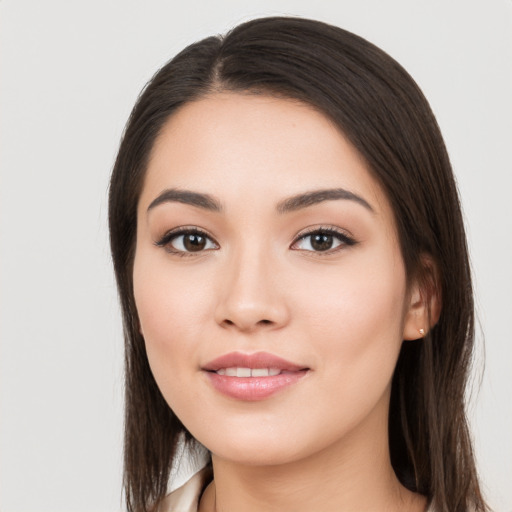 Joyful white young-adult female with long  brown hair and brown eyes