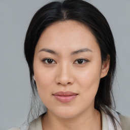 Joyful asian young-adult female with medium  black hair and brown eyes