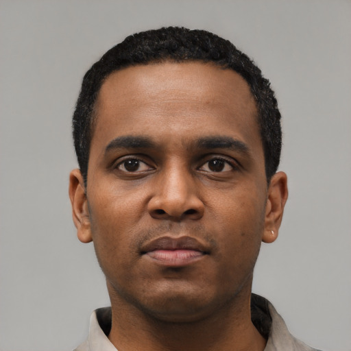 Neutral black young-adult male with short  black hair and brown eyes