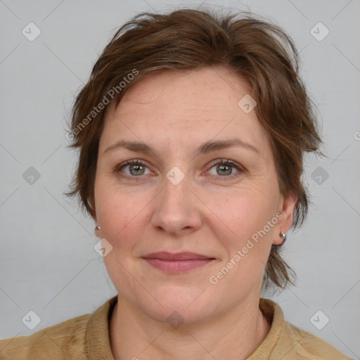 Joyful white adult female with medium  brown hair and blue eyes