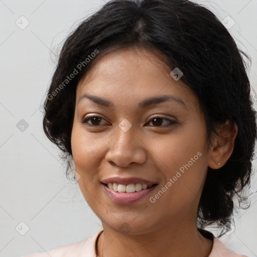 Joyful latino young-adult female with medium  brown hair and brown eyes