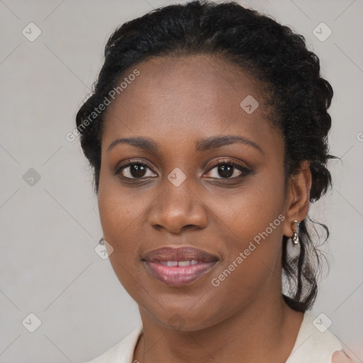 Joyful black young-adult female with medium  brown hair and brown eyes