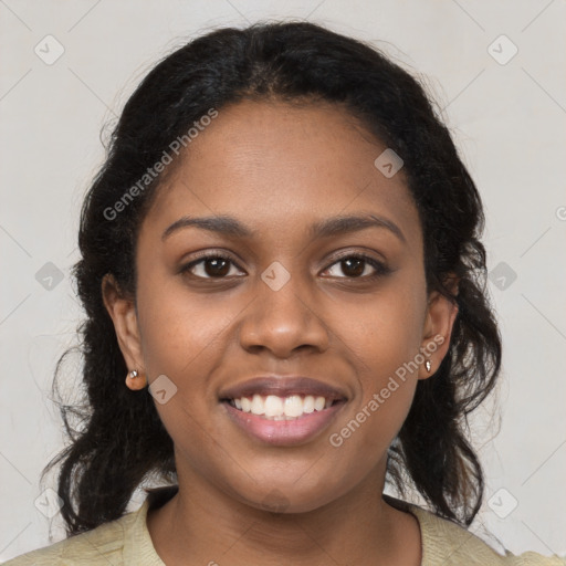 Joyful black young-adult female with medium  brown hair and brown eyes