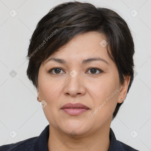 Joyful white adult female with short  brown hair and brown eyes