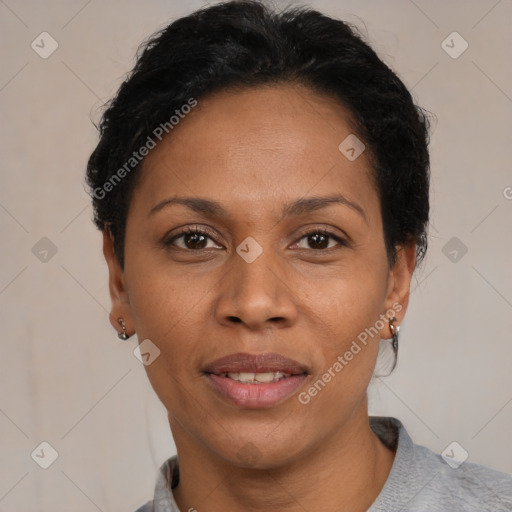 Joyful black adult female with short  black hair and brown eyes