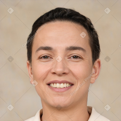 Joyful white young-adult male with short  black hair and brown eyes