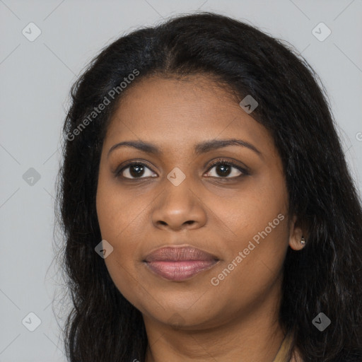 Joyful black young-adult female with long  black hair and brown eyes